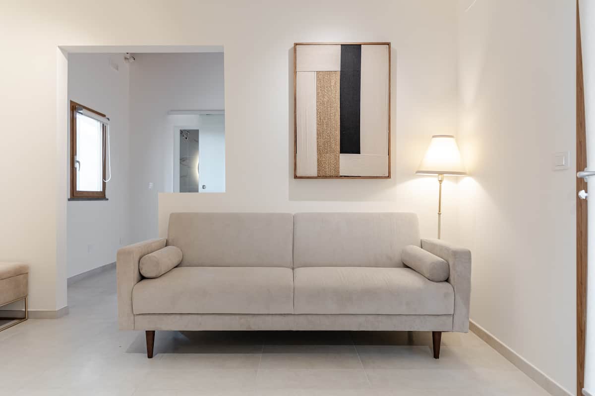 Neve living room with cream sofa and warm natural light